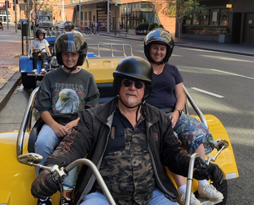 A family trike tour experience. Two trikes took a family of four around parts of Sydney Australia.